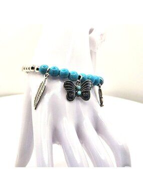 Turquoise Color Beaded Silver Tone Charm Bracelet With Feather Butterfly